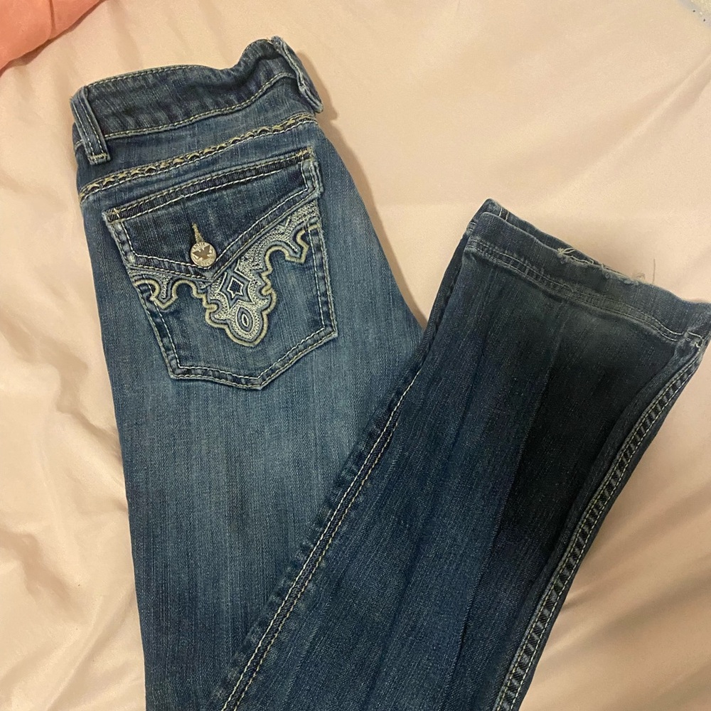 Blue bootcut jeans; low waisted